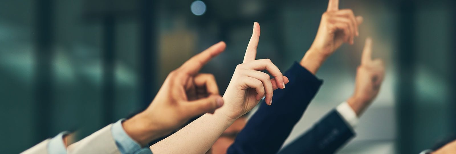 Image of hands raised for asking questions