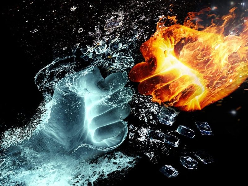 Two fists colliding. One of fire, one of water